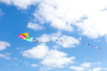 Image showing Colorful kite on a blue sky with white clouds