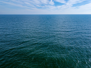 Image showing Seascape with blue sea horizon and cloudy blue sky. Aerial bird\'s eye view from drone. Copy space. Natural background