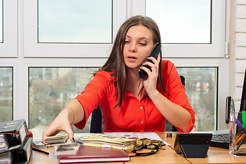 Image showing Businessman on the phone discusses the profits