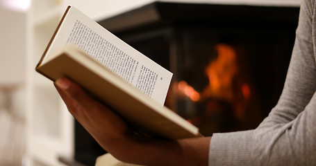 Image showing black woman at home reading book