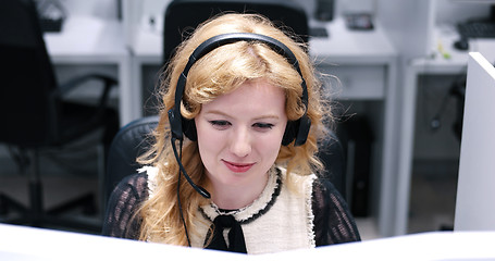 Image showing female call centre operator doing her job