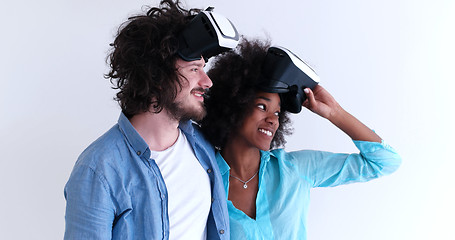 Image showing multiethnic couple getting experience using VR headset glasses