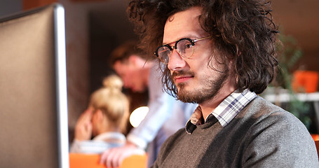 Image showing businessman working using a computer in startup office