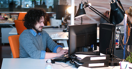 Image showing businessman working using a computer in startup office