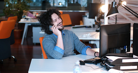 Image showing businessman working using a computer in startup office