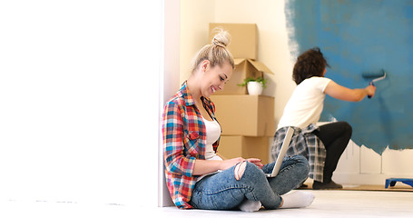 Image showing Happy couple doing home renovations