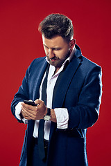 Image showing Handsome businessman with mobile phone