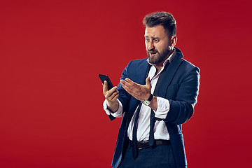 Image showing Handsome businessman with mobile phone