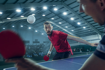 Image showing The table tennis player serving