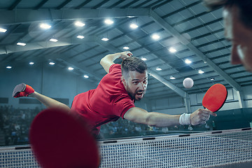 Image showing The table tennis player serving