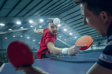 Image showing The table tennis player serving