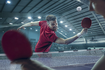 Image showing The table tennis player serving