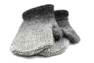 Image showing wool gray knitted mittens on a white