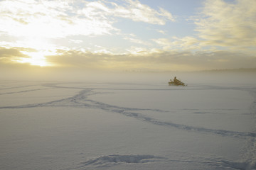 Image showing snowmobile on a lake in a frosty day