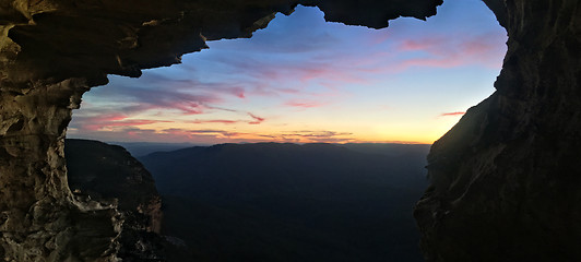 Image showing Mountain views to sunset from inside cliff cave