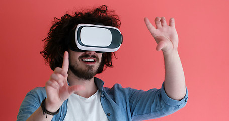 Image showing young man using VR headset glasses of virtual reality