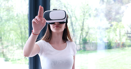 Image showing woman using VR-headset glasses of virtual reality