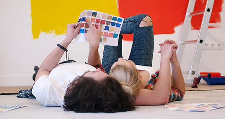 Image showing Happy young couple relaxing after painting