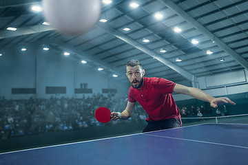 Image showing The table tennis player serving