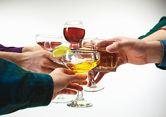 Image showing The male and female hands with exotic cocktails