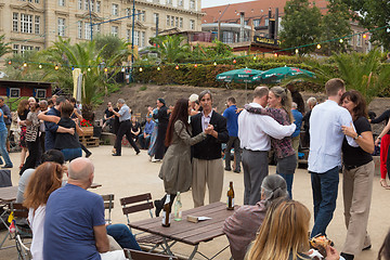 Image showing People dancing salsa outdoors at city square on one of many summer events in Berlin, Germany on 28th of september, 2016.