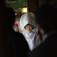 Image showing Young happy groom and bride during japanese traditional wedding ceremony at Meiji-jingu shrine in Tokyo, Japan on November 23, 2013.