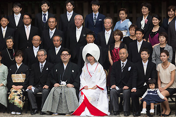 Image showing Official group photography ceremony of groom and bride,family and guests attending traditional japanese wedding at Meiji-jingu shrine inTokyo, Japan.