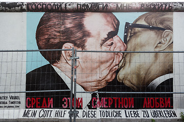 Image showing The famous Fraternal kiss graffiti: My God, Help Me to Survive This Deadly Love by Dmitri Vrubel on the Berlin Wall in Berlin, Germany.