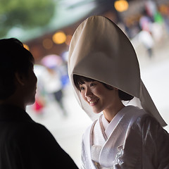 Image showing Young happy groom and bride during japanese traditional wedding ceremony at Meiji-jingu shrine in Tokyo, Japan on November 23, 2013.