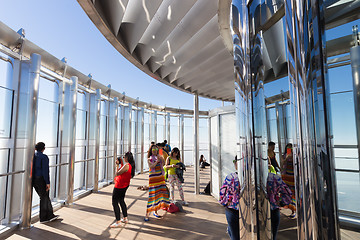 Image showing Tourists taking photos at the top the observation deck of the highest building in the world,Burj Khalifa in Dubai, UAE