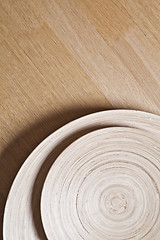 Image showing Bamboo bowls on wooden background.