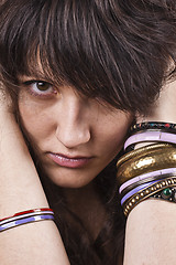 Image showing Brunet woman with bracelets.