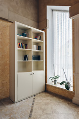 Image showing bookcase near window in the big hall