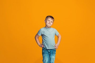 Image showing Young serious thoughtful teen boy. Doubt concept.