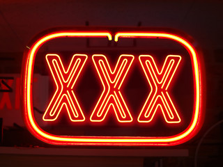 Image showing neon sign of adult night life 