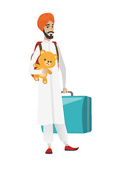 Image showing Man traveling with old suitcase and teddy bear.