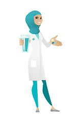 Image showing Pharmacist giving pills and glass of water.