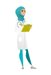 Image showing Doctor holding clipboard with documents.