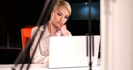 Image showing woman working on laptop in night office