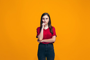 Image showing Young serious thoughtful teen girl. Doubt concept.