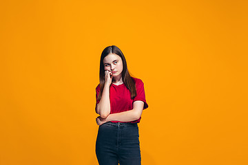 Image showing Young serious thoughtful teen girl. Doubt concept.