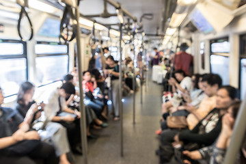 Image showing Blured image of unrecognizable asian people commuting by city subway.