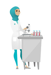 Image showing Laboratory assistant working with microscope.