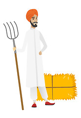 Image showing Young hindu farmer holding a pitchfork.