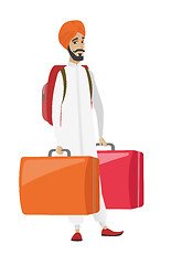 Image showing Disappointed tourist holding two big suitcases.