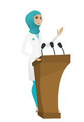 Image showing Doctor giving a speech from tribune.