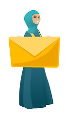 Image showing Smiling business woman holding a big envelope.