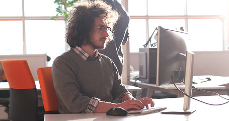 Image showing businessman working using a computer in startup office