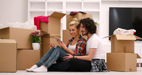 Image showing young couple moving  in new house