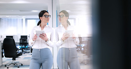 Image showing Business Woman Using Digital Tablet in front of Office